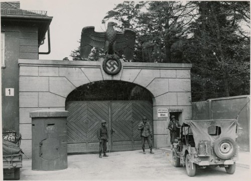 US Army jeep at the gates of Dachau, 1945