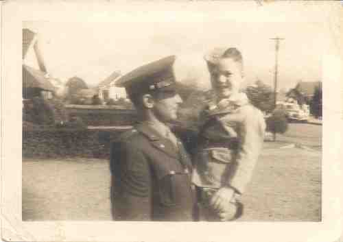 Carl, the mystery flier, holds Tommy Ragsdale